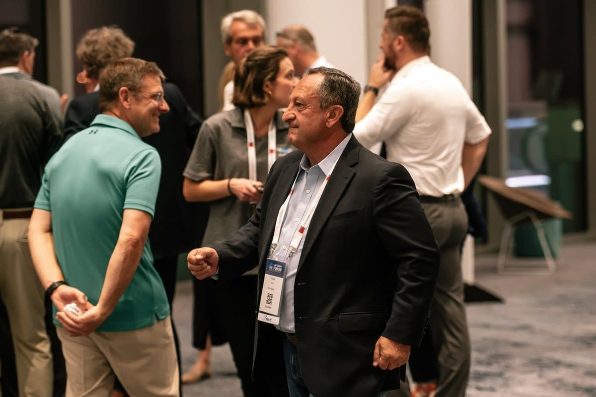 Two delegates in conversation at the Air Cargo Forum