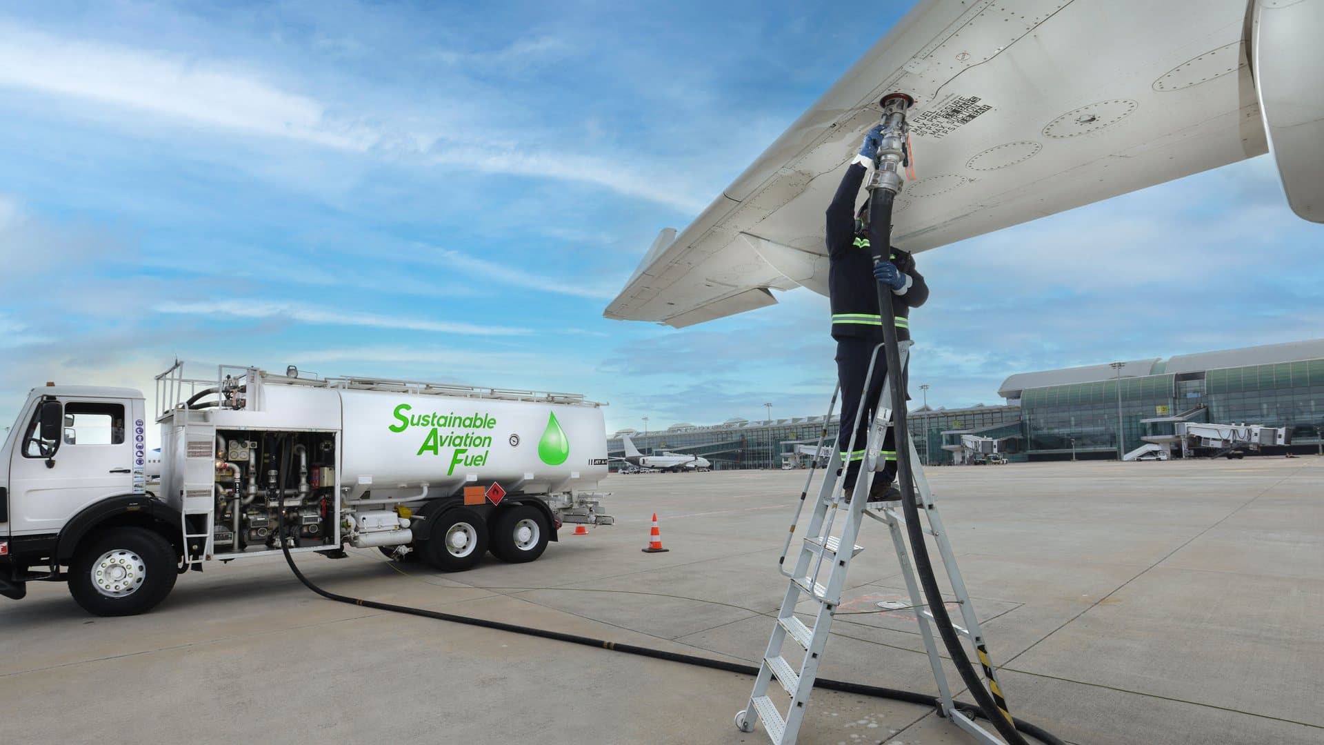 Sustainable aviation fuel being loaded into an aircraft wing tank